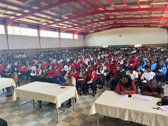 Wide view of the exhibition hall packed with high-school learners