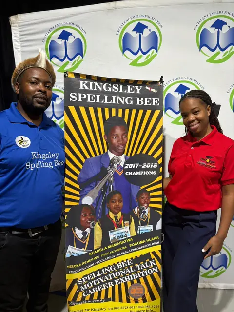 Organisers beside the Kingsley Spelling Bee banner at the competition